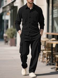 Detail of black corduroy texture on men's casual shirt and cargo pants utility set