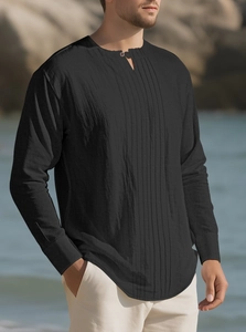 Close-up of black cotton linen Henley shirt featuring pleated texture and mandarin collar