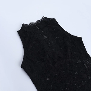 Detail of high neck black lace sleeveless top showing intricate floral hollow patterns