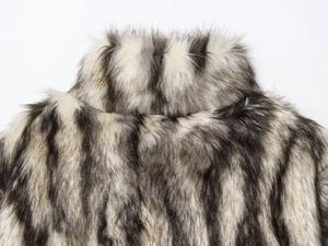 Close-up of fluffy faux fur collar with black, white and grey striped texture