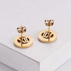 Gold-plated stainless steel stud earrings featuring Roman numeral cutout design
