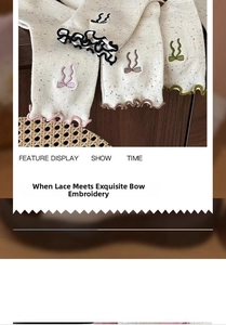 Detailed macro view of knitted cotton socks with ruffles and bow embroidery accents