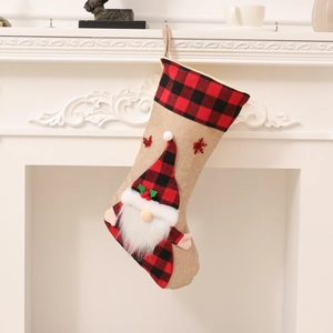 3D Santa Claus Christmas stocking in red buffalo plaid hung on a white vintage fireplace