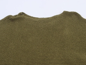 Detail of olive green knit sweater showing delicate lace crochet and crew neckline