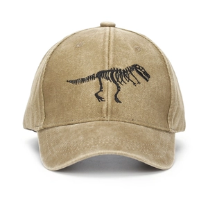 Close-up of black dinosaur skeleton embroidery on khaki vintage washed cotton baseball cap