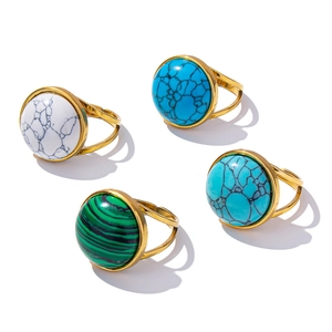 Set of four adjustable gold-plated stainless steel rings with colorful round gemstones