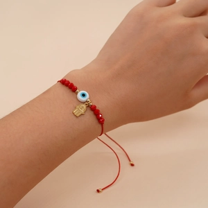 Handmade red woven Evil Eye and Hamsa Hand charm bracelet with crystals for protection