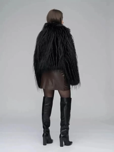 Back view of a chic black faux fur coat for women with long plush texture details