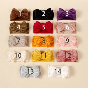 Set of 14 colorful corduroy bow headbands for babies and toddlers in various vibrant shades