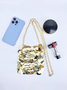Sparkling gold sequin crossbody bag with chain strap and luxury fashion details