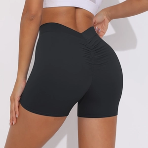 Close-up of black high-waisted gym shorts featuring booty scrunch and V-shaped waistband