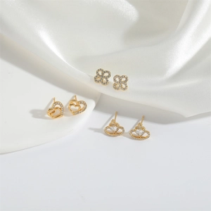 Elegant gold earrings set featuring clover, double heart and crown heart designs with crystals