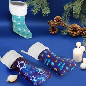 Close-up of Hanukkah stockings featuring Happy Hanukkah text and festive symbols