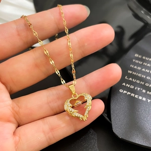 Micro-set zircon heart pendant necklace with rotating crystal in gold plated copper