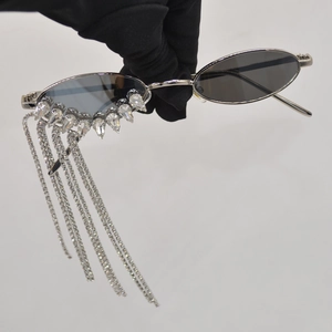 Luxe oval sunglasses with silver metal frames and sparkling crystal fringe tassels