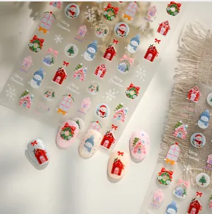Détails de stickers ongles Noël avec bonhommes de neige, maisons et flocons de neige