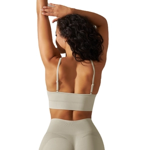 Seamless light grey ribbed yoga bra and leggings set with adjustable straps and open back