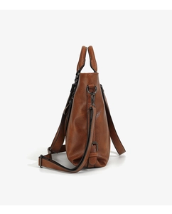 Side view of large brown soft leather tote bag with adjustable shoulder strap and hardware