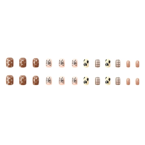 24pcs cow print press-on nails with bow patterns and mixed geometric designs in glossy finish