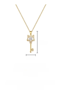 Detail showing gold cat key pendant dimensions with white zircon inlay and heart motif