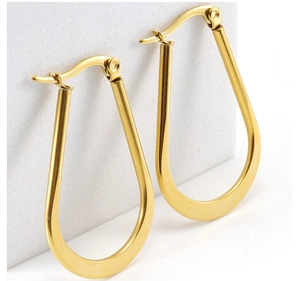Detailed view of polished 18K gold plated stainless steel U-shaped hoop earrings