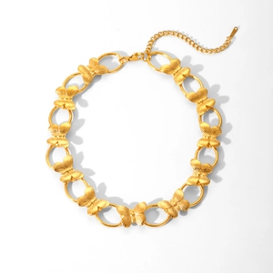 Detail of a gold butterfly link necklace with an oval chain and lobster clasp closure