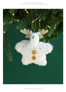 Close-up of white plush reindeer ornament with gold antlers and bells on a Christmas tree