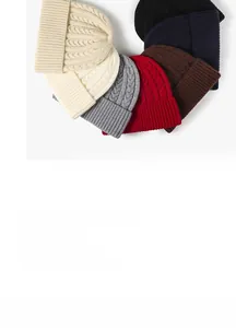 Multiple colors of thick cable knit beanies featuring classic ribbed fold-over cuffs