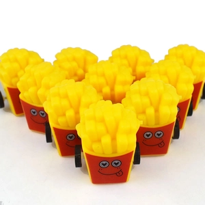 Multiple mini pull-back toy cars shaped like French fries with cute smiley faces