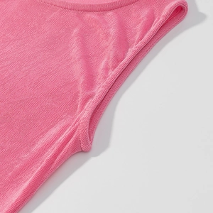 Close-up of pink knitted dress cuffs featuring fine pleated texture and smooth stitching