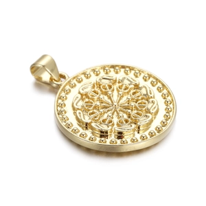 Detailed view of a gold relief circular pendant featuring symmetrical vintage patterns