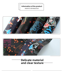 Detail showing game console pattern gift wrapping paper with pixel art and play game text