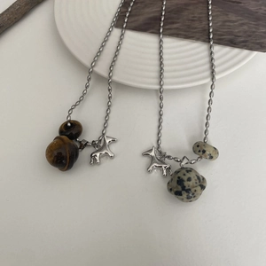 Minimalist silver bead chain necklace featuring tiger eye stone and pony pendant
