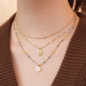 Three-layer bohemian gold necklace with colorful beads and daisy flower pendant