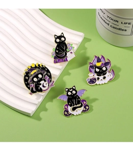 Set of four Halloween black cat enamel pins featuring magic books, skulls and witch hats