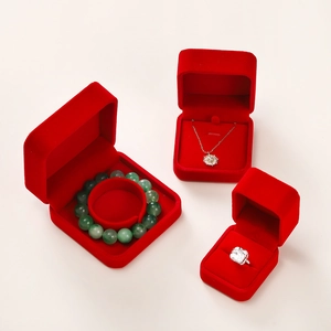 Detailed view of red velvet jewelry boxes for rings necklaces and bracelets storage