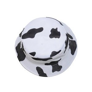 Summer cotton bucket hat for women featuring a stylish black and white cow print pattern