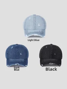 Close-up of distressed denim baseball caps in light blue, dark blue, and black colors