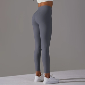 Side view of high-waisted gray-blue yoga leggings showing lifting and shaping effect