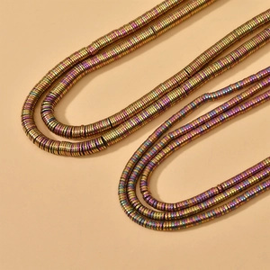 Close-up of rainbow hematite flat disc spacer beads for DIY jewelry making