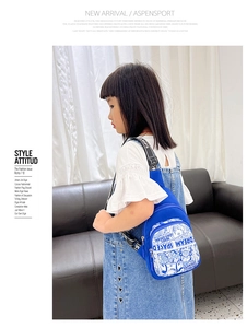 Close-up of blue kids chest bag featuring space bear cartoon and Dream Space graphics