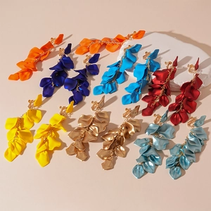 Detailed view of colorful layered petal tassel earrings with adjustable clip-on backing