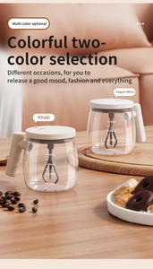 Detail view of 400ml electric self-stirring glass mugs with volume scale and ergonomic handle