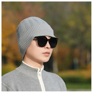 Detailed close-up of grey ribbed knit beanie showing high-quality texture and weave