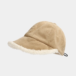 Detail of kids winter bucket hat showing corduroy texture and white sherpa fur brim