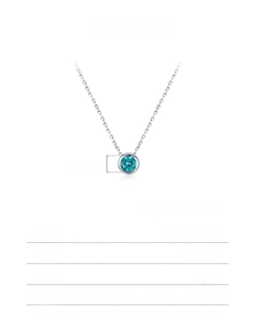Macro detail of S925 sterling silver necklace with a 5mm blue gemstone pendant