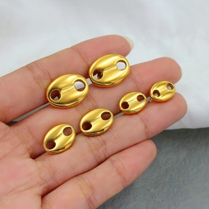 Polished 18K gold coffee bean stud earrings in three sizes on a minimalist background