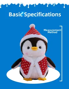 Detail of Christmas penguin plush with festive red hat, snowflake vest and silver bell