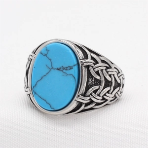 Vintage oval blue stone ring with celtic patterns in polished silver stainless steel