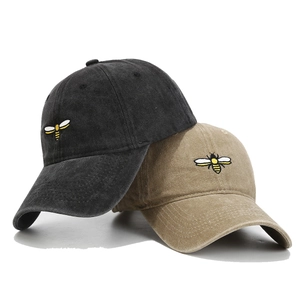 Washed cotton baseball caps with bee embroidery in dark grey and khaki colors